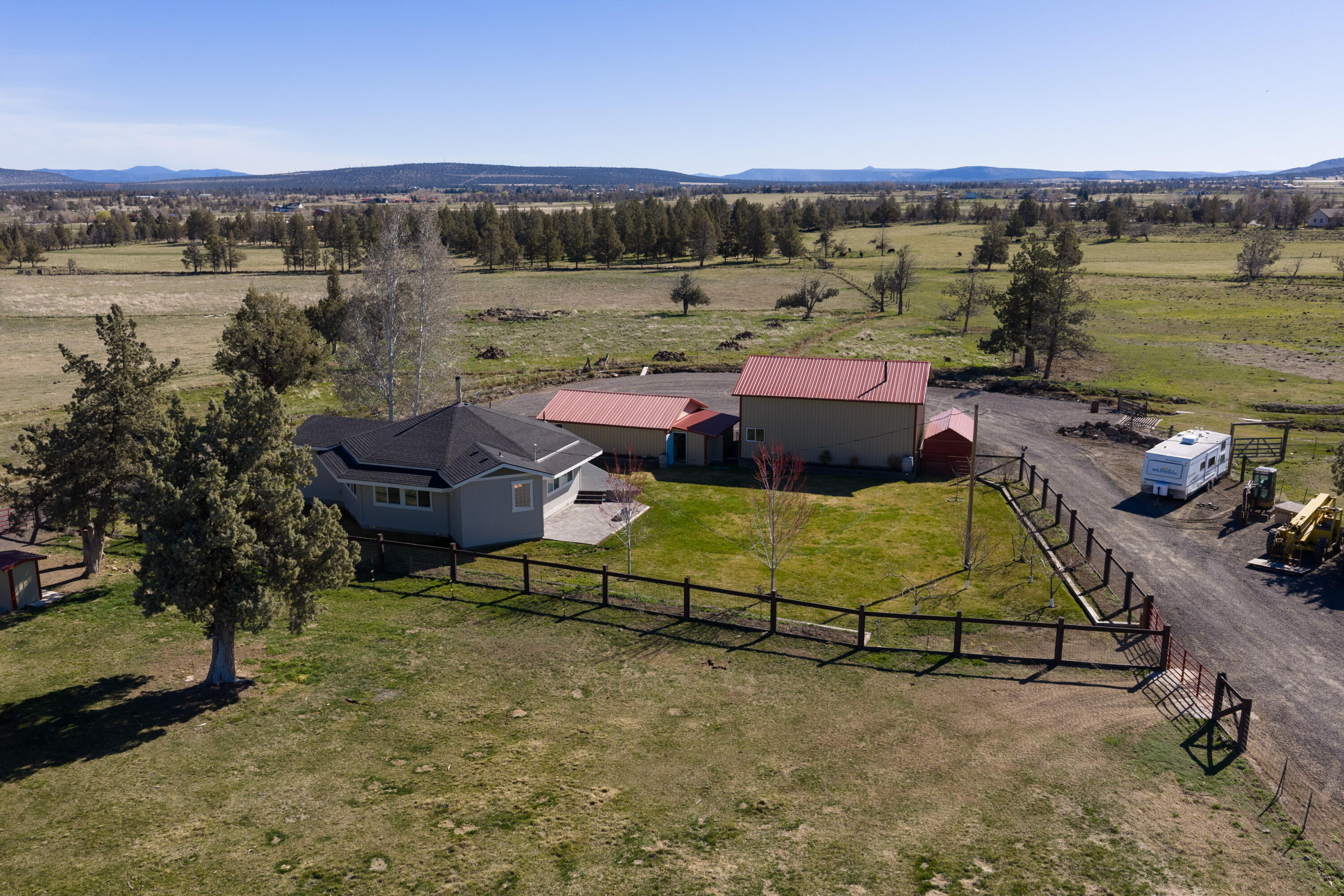 4074 Southwest Reif Road Powell Butte, OR 97753 - Photo 51 of 59 a view of a swimming pool with a lounge chairs