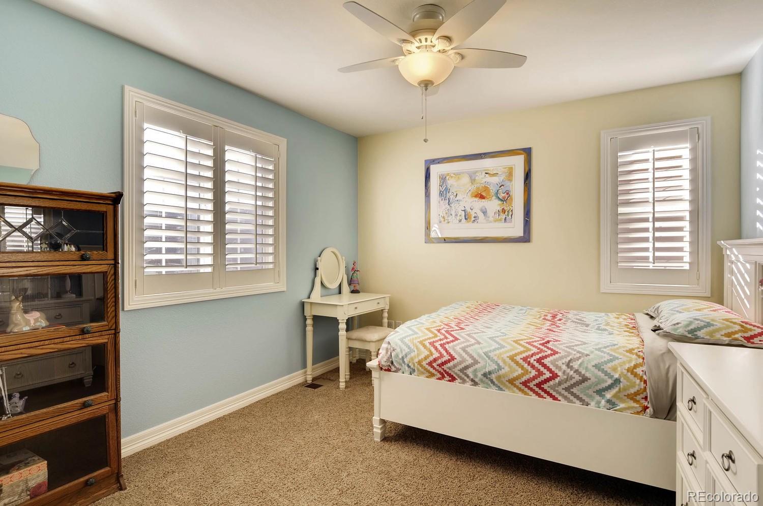 10560 Sundial Rim Road Highlands Ranch, CO 80126 - Photo 15 of 27 a bedroom with a bed and a window