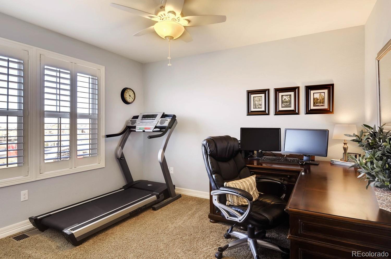 10560 Sundial Rim Road Highlands Ranch, CO 80126 - Photo 17 of 27 a view of a workspace with furniture and a window