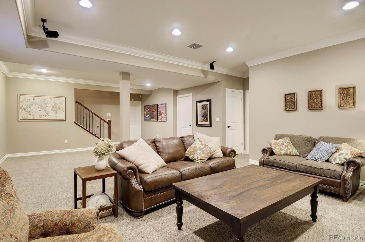 10560 Sundial Rim Road Highlands Ranch, CO 80126 - Photo 22 of 27 a living room with furniture and a wooden floor