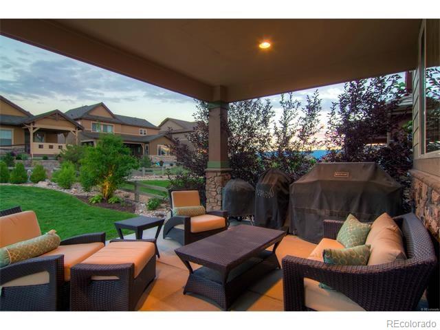 10560 Sundial Rim Road Highlands Ranch, CO 80126 - Photo 26 of 27 a outdoor living space with patio and mountain view