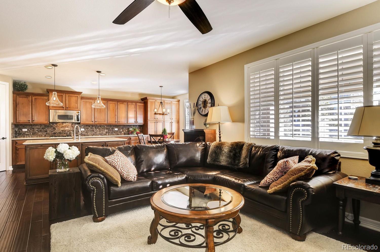 10560 Sundial Rim Road Highlands Ranch, CO 80126 - Photo 8 of 27 a living room with furniture and a large window