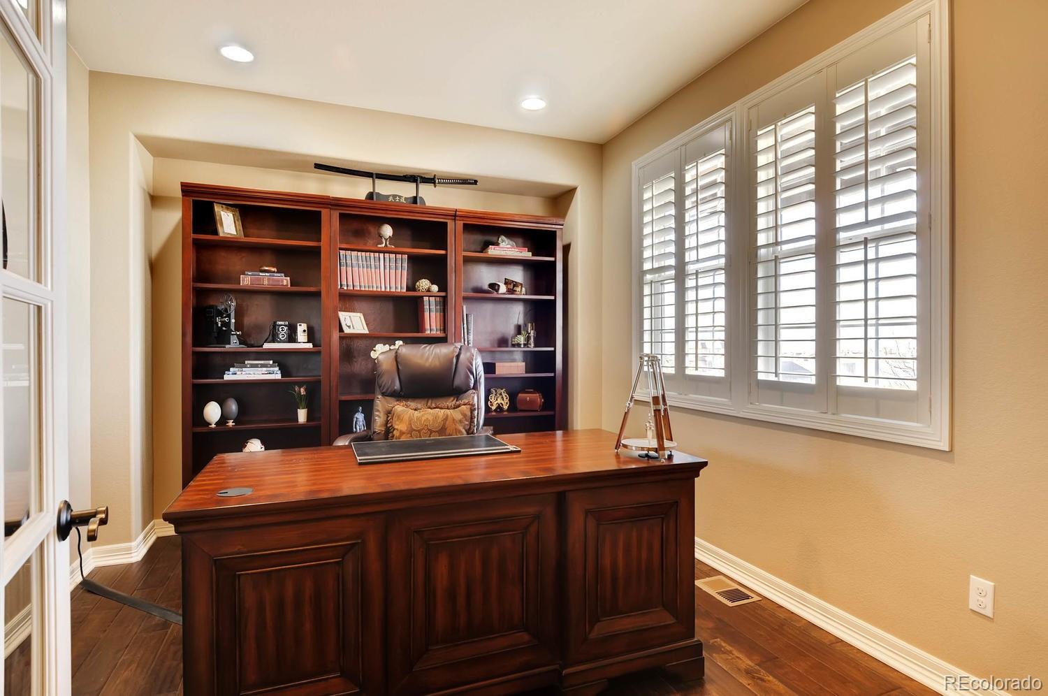 10560 Sundial Rim Road Highlands Ranch, CO 80126 - Photo 10 of 27 a room with furniture and window