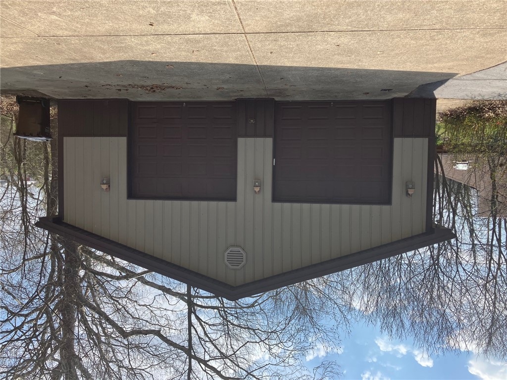 2066 Tolbert Road Hamilton, OH 45011 - Photo 36 of 63 Two-car garage with overhead doors and light-toned siding.