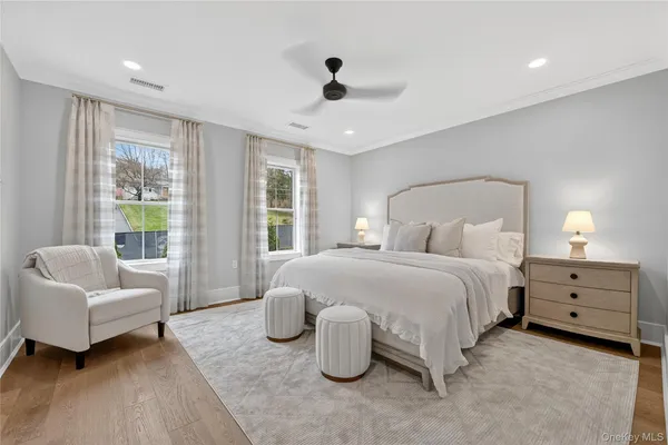 a spacious bedroom with a bed and a couch