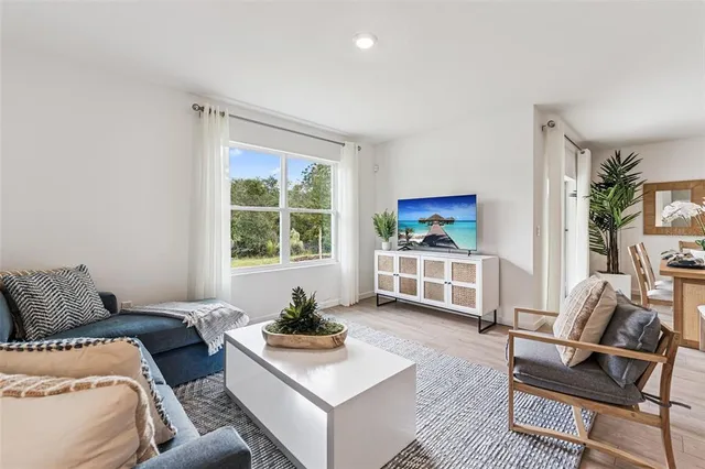 a bedroom with furniture and a window