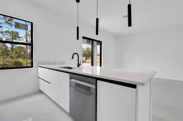 a kitchen with a sink and a window