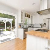 a kitchen with granite countertop a refrigerator and a stove