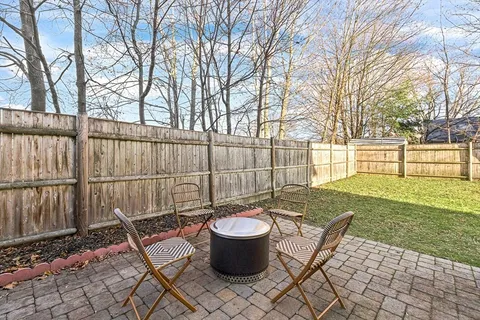 a view of a backyard with sitting area