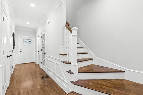a view of entryway with wooden floor