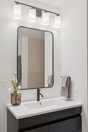 a bathroom with a sink and a mirror