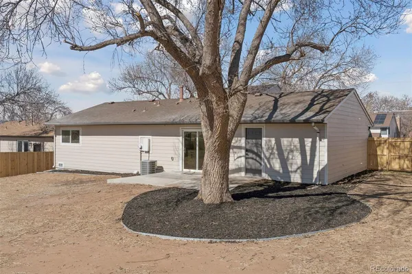 a view of house with a yard
