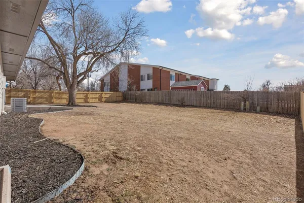 a view of a backyard with a trees