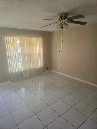 a view of an empty room and a window
