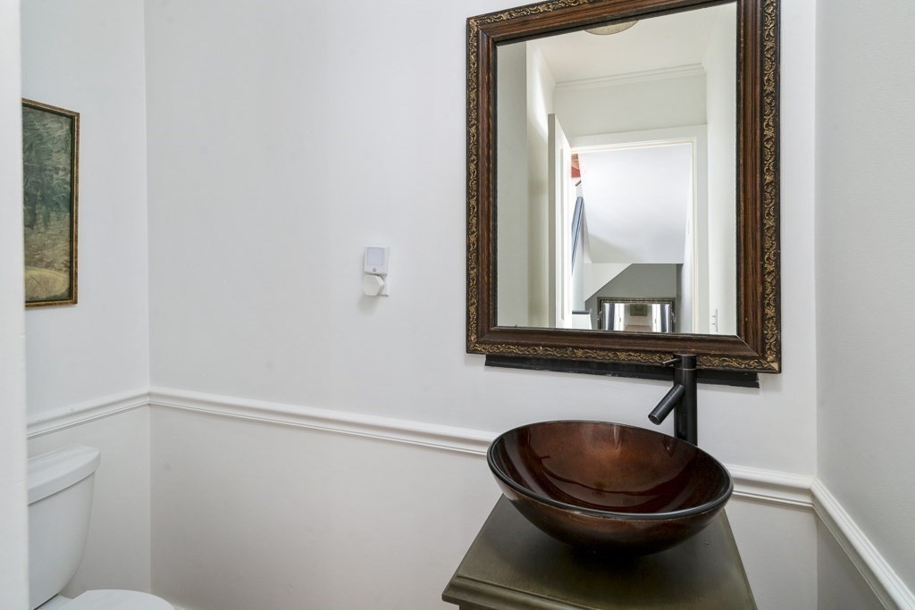48 Roberts Road Cambridge, MA 02138 - Photo 8 of 19 a bathroom with a toilet and a mirror