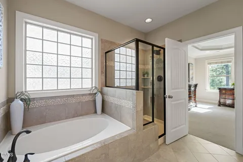 a bathroom with a tub and shower