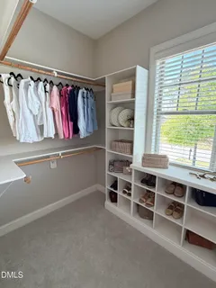 a view of an empty room with shelves
