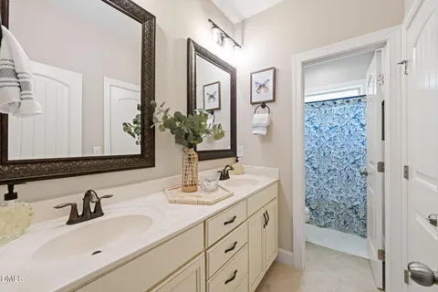 a bathroom with 2 sink and a mirror