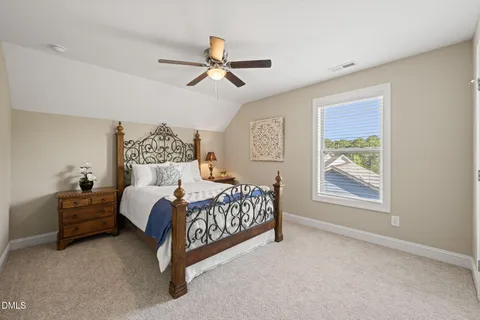 a bed room with a bed and a window