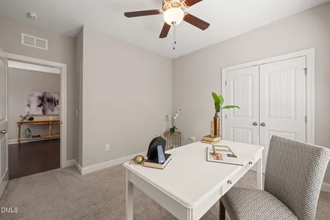 a view of a workspace with furniture