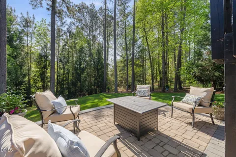 a view of a patio with couple of chairs
