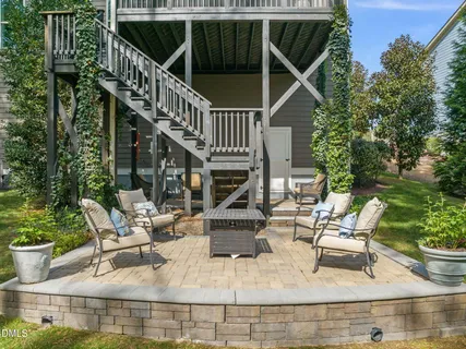a view of a patio with a table and chairs