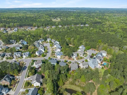 an aerial view of a house with a yard and garden