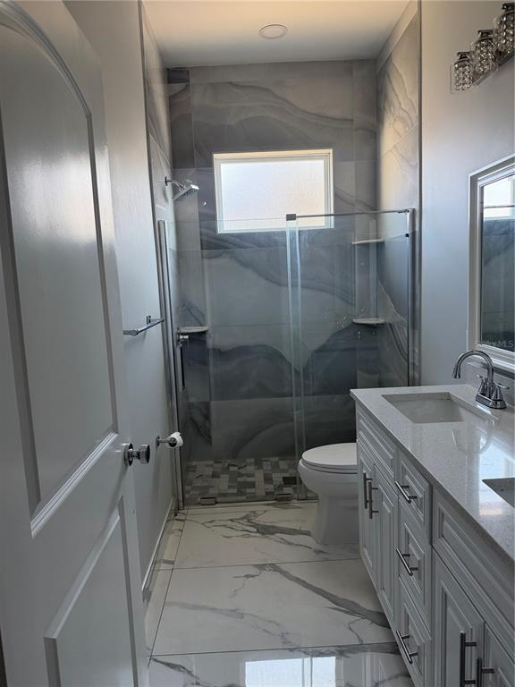 5315 3rd Bradenton, FL 34203 - Photo 11 of 41 a bathroom with a double vanity sink toilet and shower