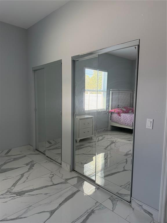 5315 3rd Bradenton, FL 34203 - Photo 13 of 41 a bedroom with a bed and a window