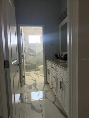 a bedroom with a bed and a cabinets