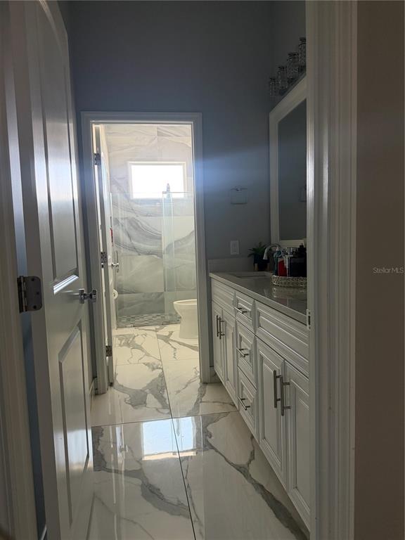 5315 3rd Bradenton, FL 34203 - Photo 16 of 41 a bathroom with a double vanity sink and a mirror