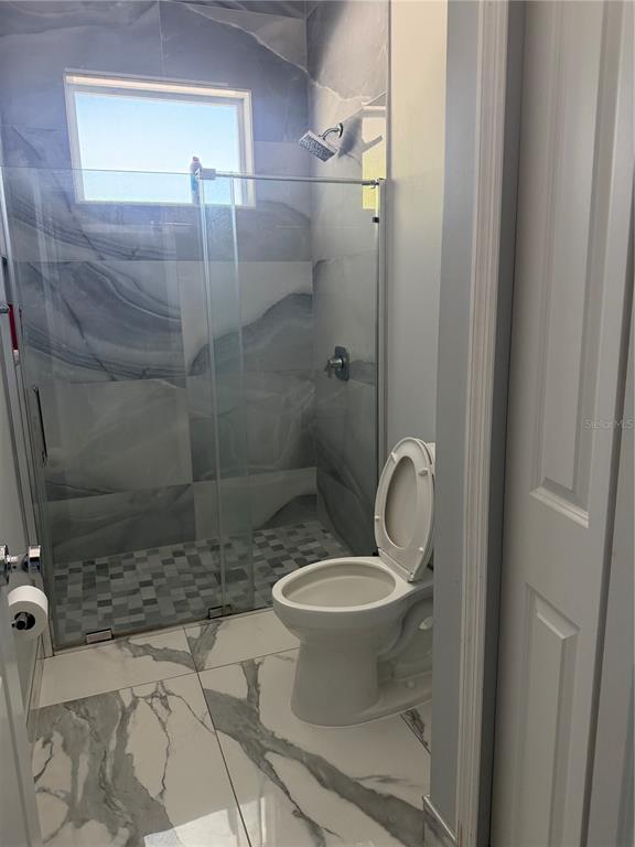 5315 3rd Bradenton, FL 34203 - Photo 17 of 41 a bathroom with a sink toilet and shower