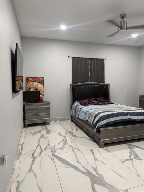 5315 3rd Bradenton, FL 34203 - Photo 18 of 41 a bedroom with a bed and flat screen tv