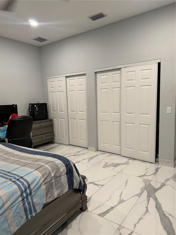 5315 3rd Bradenton, FL 34203 - Photo 19 of 41 a bedroom with a bed and a cabinets