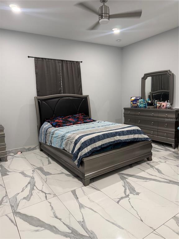 5315 3rd Bradenton, FL 34203 - Photo 20 of 41 a bedroom with a bed and a mirror