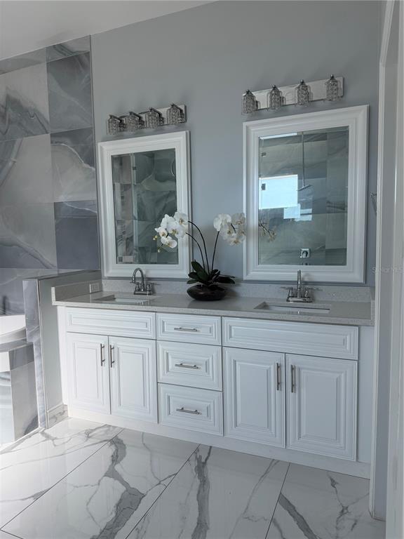 5315 3rd Bradenton, FL 34203 - Photo 23 of 41 a bathroom with a granite countertop sink and mirror