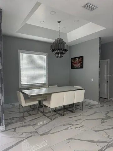 a bathroom with a double vanity sink toilet and shower