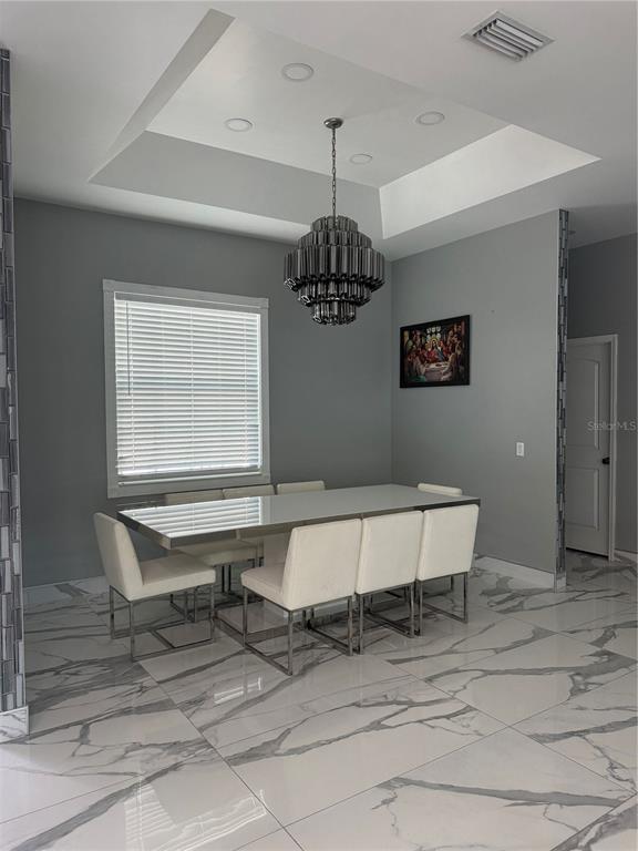 5315 3rd Bradenton, FL 34203 - Photo 9 of 41 a living room with a table and a window