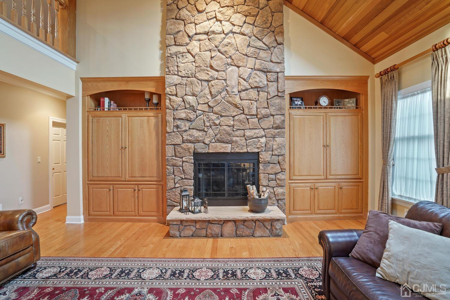 73 Davidson's Mill Road North Brunswick, NJ 08902 - Photo 11 of 51 a living room with furniture and a fireplace