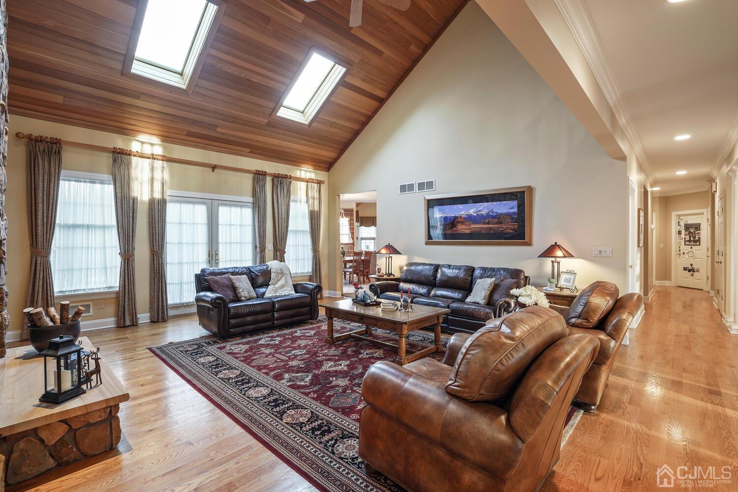73 Davidson's Mill Road North Brunswick, NJ 08902 - Photo 12 of 51 a living room with furniture large window and a rug
