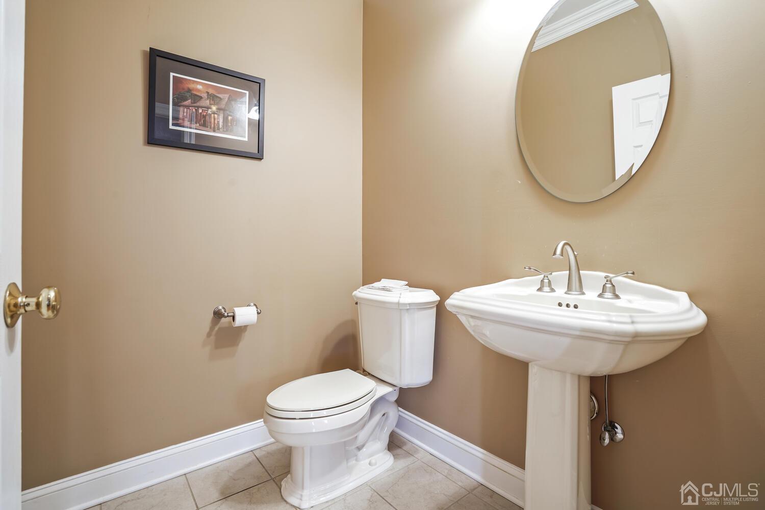 73 Davidson's Mill Road North Brunswick, NJ 08902 - Photo 17 of 51 a bathroom with a toilet and a sink
