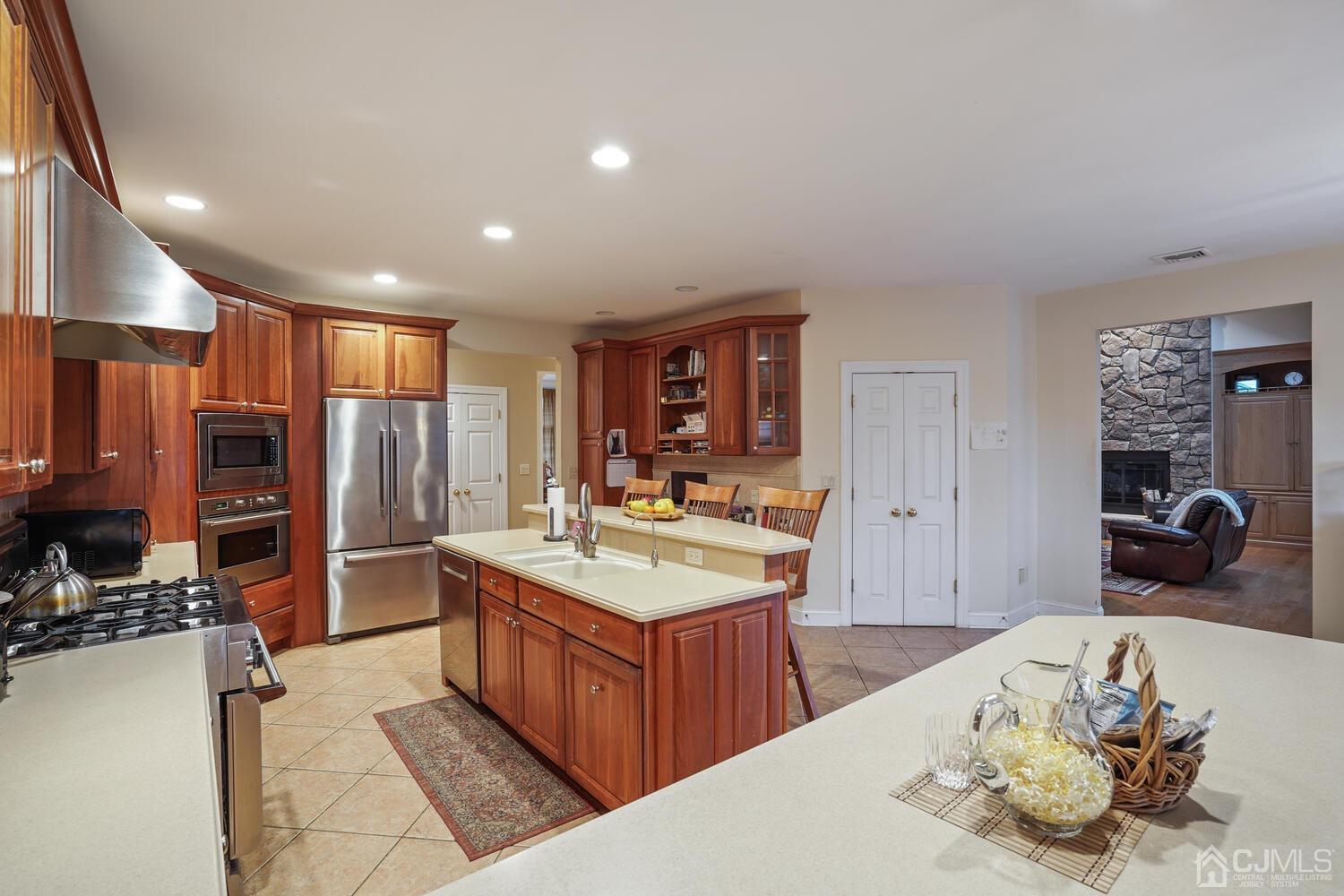 73 Davidson's Mill Road North Brunswick, NJ 08902 - Photo 20 of 51 a large kitchen with a large counter top appliances and cabinets
