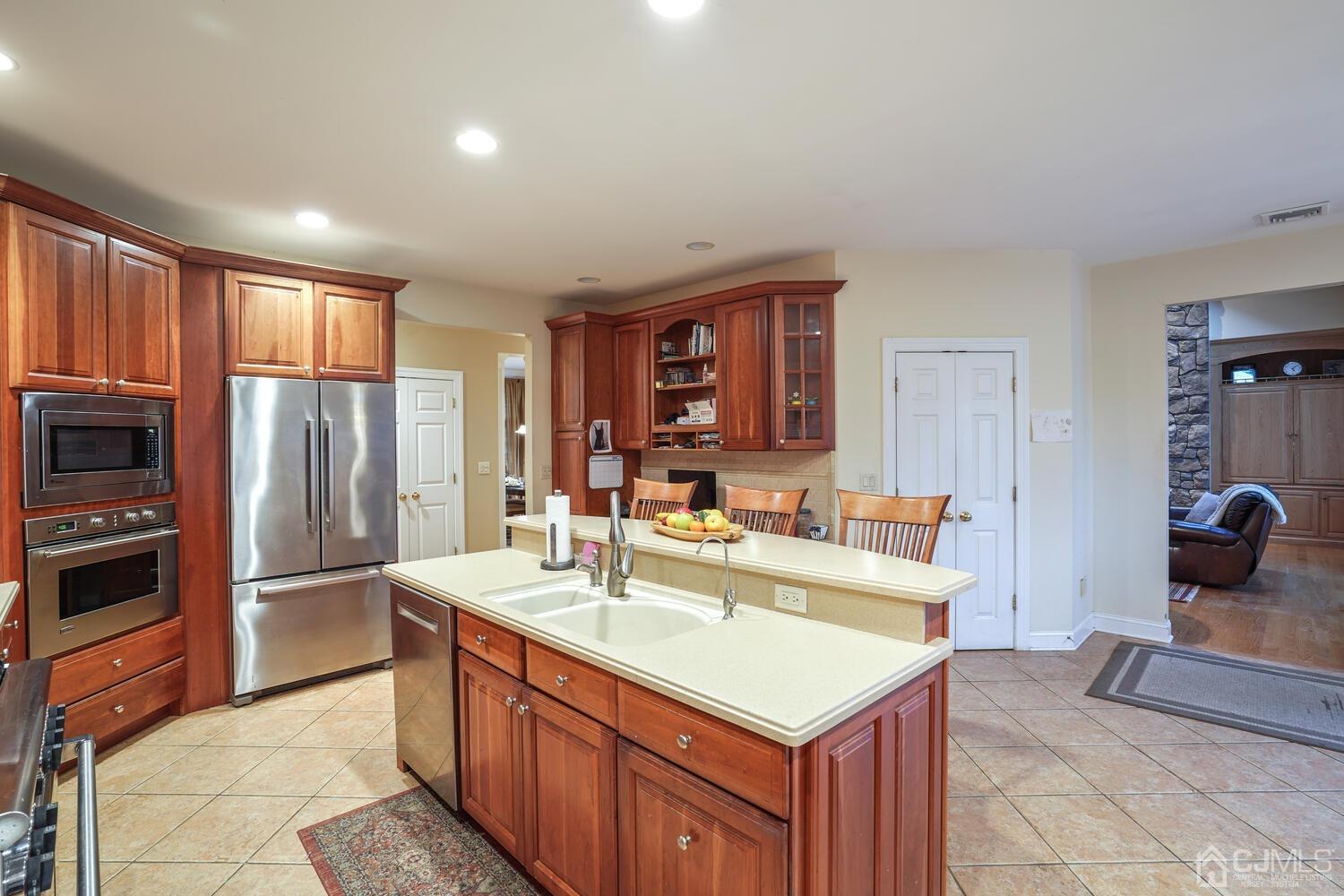 73 Davidson's Mill Road North Brunswick, NJ 08902 - Photo 22 of 51 a large kitchen with kitchen island a sink stainless steel appliances and cabinets