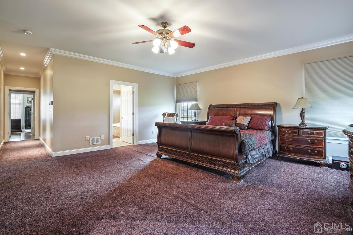 73 Davidson's Mill Road North Brunswick, NJ 08902 - Photo 30 of 51 a bedroom with a bed and a chandelier