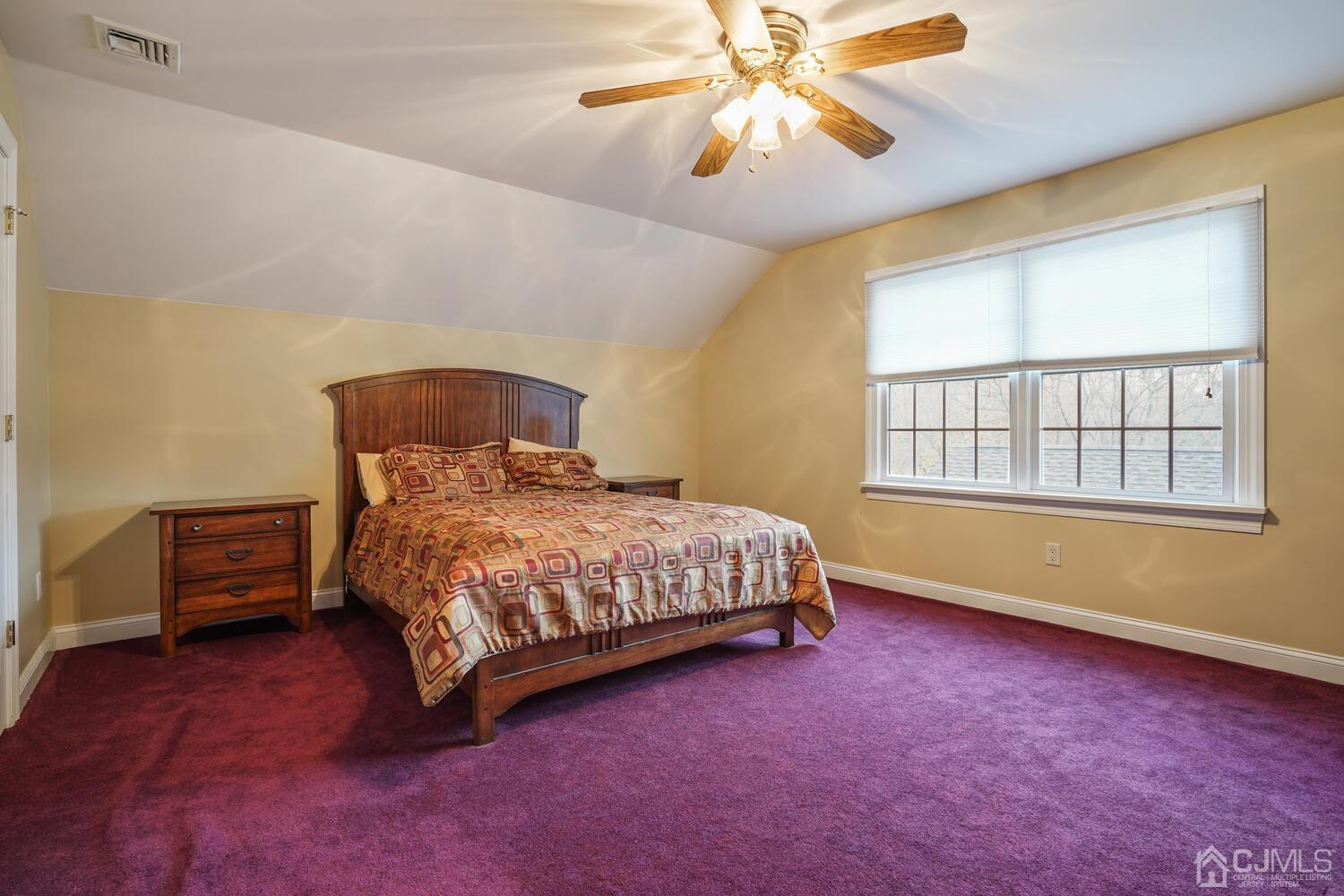 73 Davidson's Mill Road North Brunswick, NJ 08902 - Photo 37 of 51 a bedroom with a bed and a chandelier
