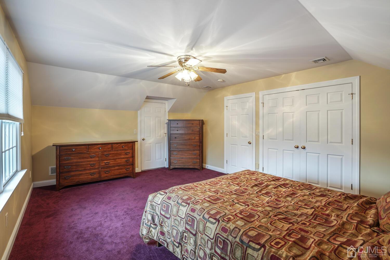 73 Davidson's Mill Road North Brunswick, NJ 08902 - Photo 38 of 51 a bedroom with a bed chandelier and a window
