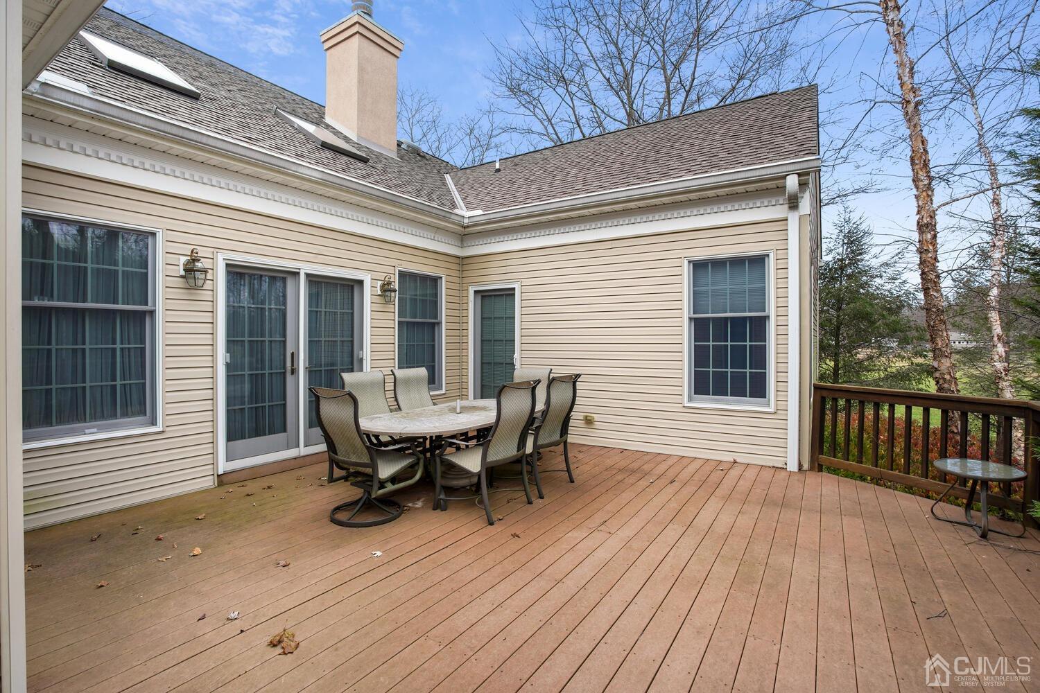 73 Davidson's Mill Road North Brunswick, NJ 08902 - Photo 45 of 51 a roof deck with table and chairs and wooden floor