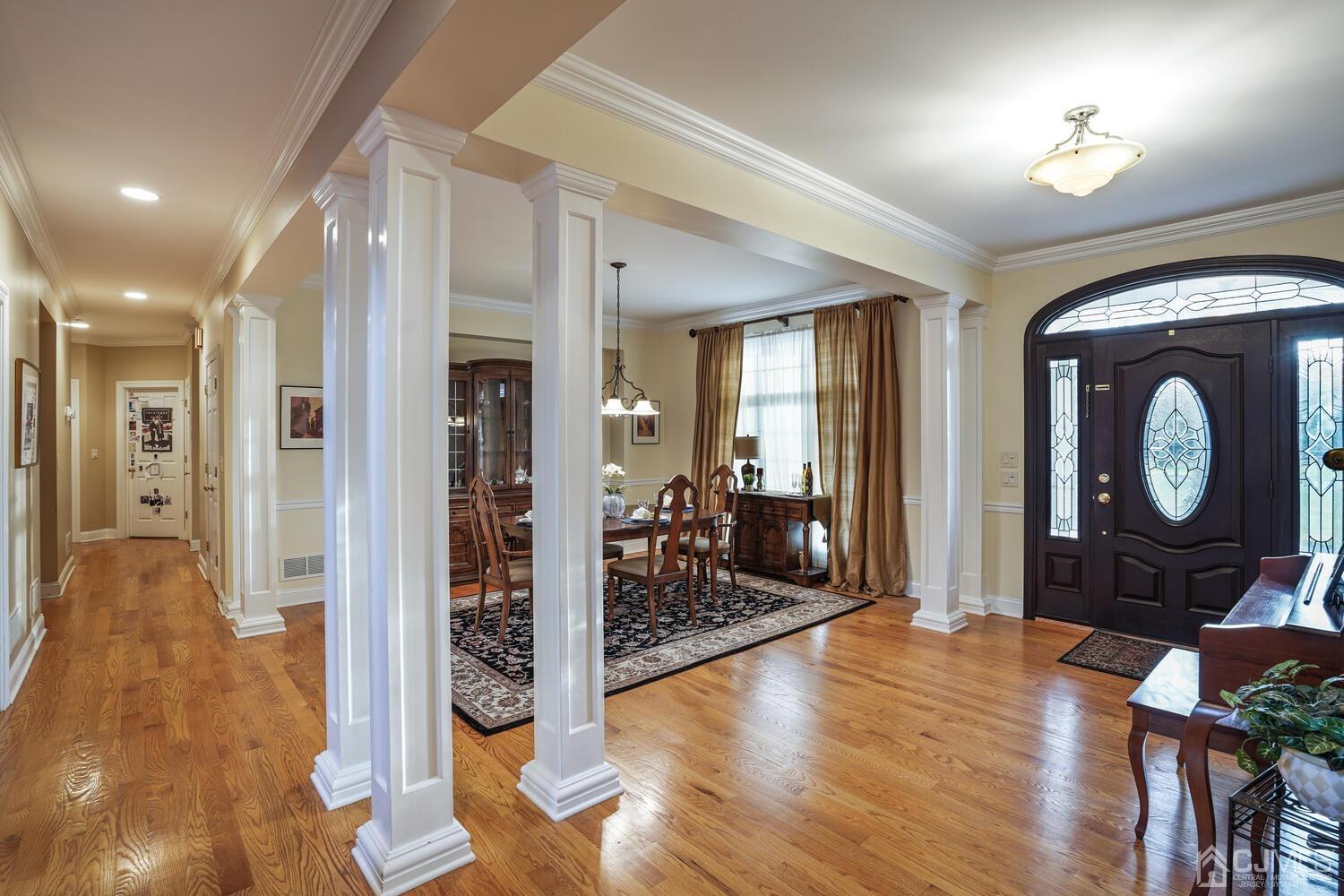 73 Davidson's Mill Road North Brunswick, NJ 08902 - Photo 6 of 51 a view of a hallway with wooden floor fireplace and living room