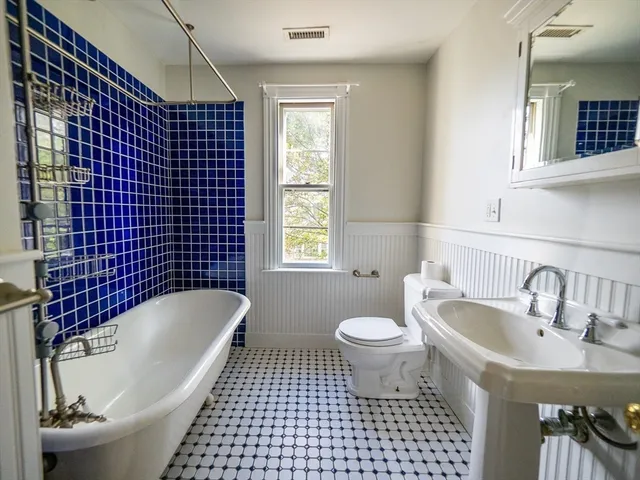 a view of an empty room and wooden floor