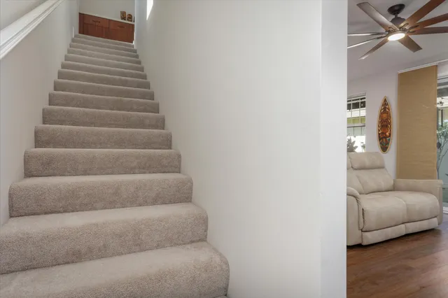 a bedroom with a bed and chandelier